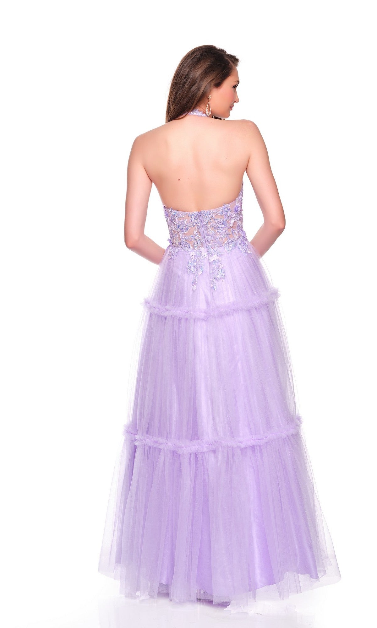 A woman is shown from the back wearing the Dave & Johnny 11966, a light pink halter prom dress—an enchanting alternative to a classic strapless lavender gown with a tiered tulle skirt and floral embroidery.