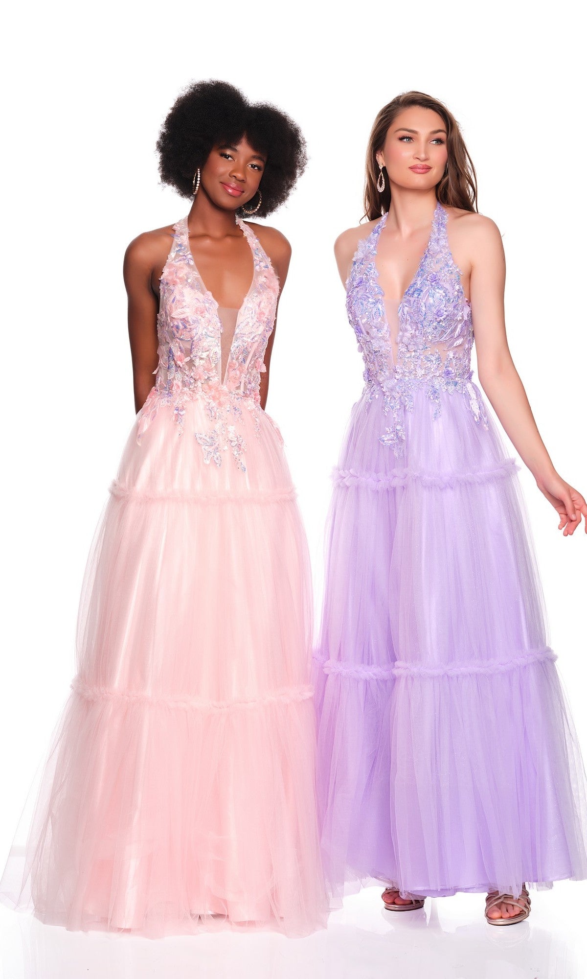 Two women stand side by side in tulle gowns with floral embroidery; one wears the Light Pink Halter Prom Dress by Dave & Johnny 11966, while the other wears a lavender gown with an a-line skirt.