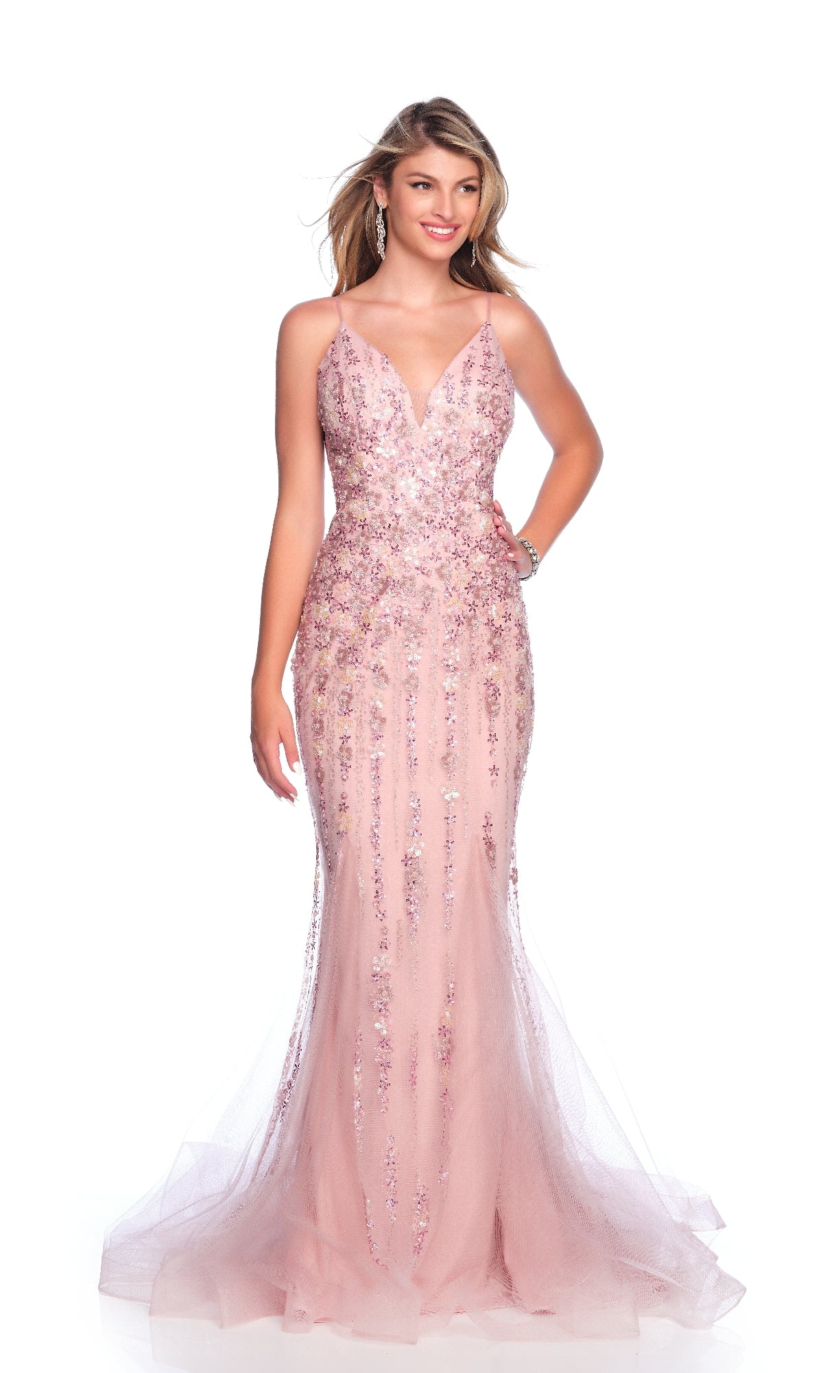 A woman models the Dave and Johnny 12004 long prom dress, featuring light pink sequins and a sleeveless, floor-length silhouette, set against a white background.