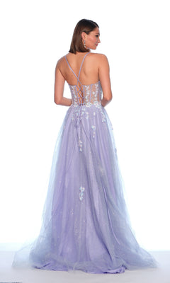 A woman models the Dave and Johnny 12015 long prom dress with light purple 3D flowers, a lace-up sheer back, and an embroidered lace corset bodice, standing gracefully against a white background.