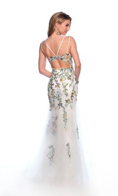 A woman stands against a white background wearing the Dave & Johnny 12016, a long white prom dress featuring floral embroidery, thin straps, a floor-length mermaid silhouette, and an open back cutout.