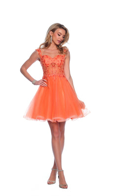 A woman models the Orange Homecoming Dress 12038, featuring floral embellishments and a tulle skirt, while wearing heels against a white background.