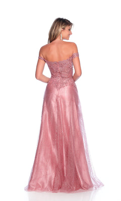 A woman stands facing away in the Mauve Pink Prom Dress: Dave & Johnny 12084, featuring an off-the-shoulder bodice, glitter tulle skirt, and intricate beading. The floor-length gown flares elegantly against a white backdrop.