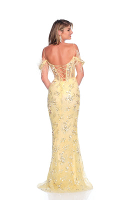 A woman faces away wearing the Dave & Johnny 12095 pastel yellow prom dress, featuring feather off-the-shoulder straps, floral sequins, an open lace-up back, and a fitted floor-length silhouette.