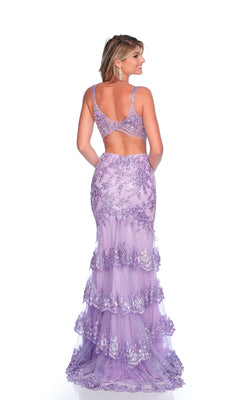 A woman in the Lilac Mermaid Prom Dress: Dave & Johnny 12125, a floor-length sleeveless gown featuring sequin floral patterns, tiered ruffles, and a back cutout, stands facing away.