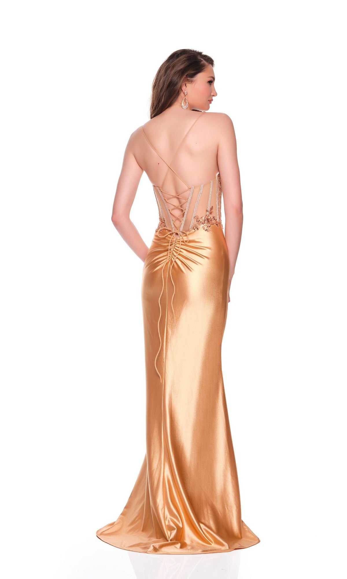 A woman in the Dave & Johnny 12239 Long Sleek Prom Dress with a fitted gold satin skirt, lace-up back, and high-leg slit poses with her back to the camera against a white background.