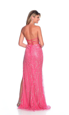 A woman faces away, wearing the Strapless Pink Prom Dress: Dave & Johnny 12243—a floor-length, bright sequined gown with an open back and side slit.
