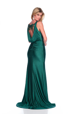 A woman in the Dave & Johnny 12279 long prom dress, featuring emerald green fabric, a draped back, v-neckline, and beaded details, stands facing backward against a white background.