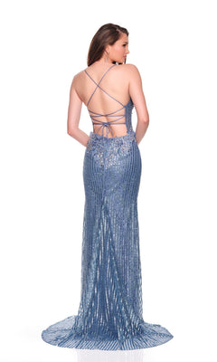 A woman poses against a white background wearing the Long Prom Dress: Dave & Johnny 12281, a shimmery light blue backless gown with crisscross straps, sparkly beading, and a floor-length train.