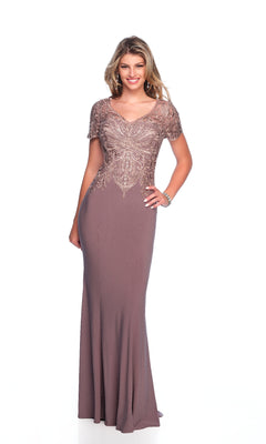 A woman poses against a white background wearing the Long Formal Dress: Dave and Johnny 12321, a mauve floor-length gown with short lace sleeves and an embellished bodice.