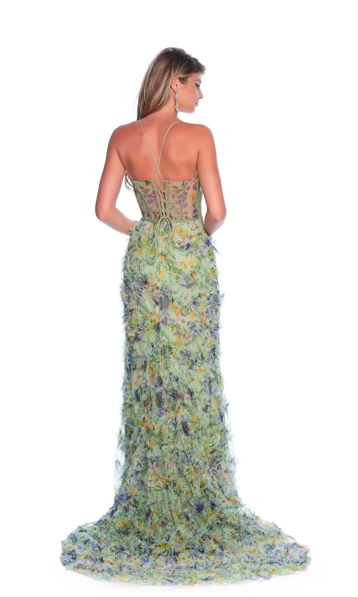 A woman faces away, wearing the Dave & Johnny 12327 green floral-print prom dress with spaghetti straps, lace-up back, sheer corset bodice, floor-length skirt, textured flower pattern, and a slight train.