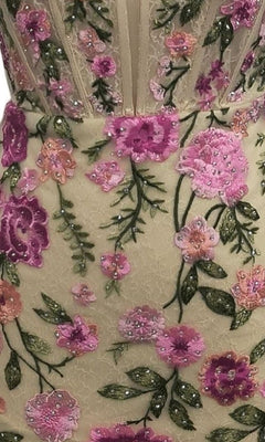 Close-up of Short Homecoming Dress: 12370 in beige floral lace with pink and purple embroidered flowers, green leaves, a corset bodice, and beaded embellishments.