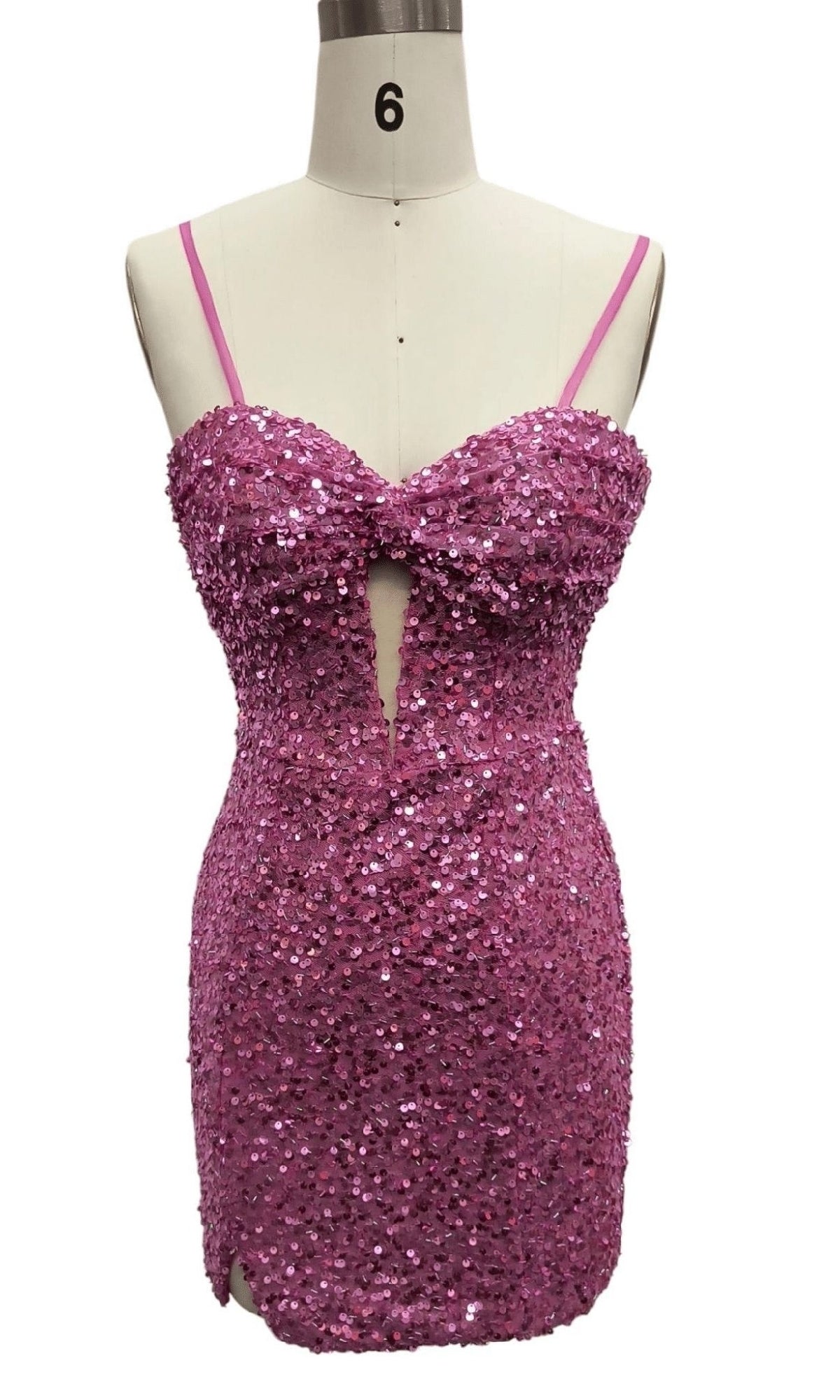Mannequin shows the Dave and Johnny 12393 Pink Sequin Homecoming Dress—sleeveless, form-fitting, with thin straps, center front cutout, and mini length for a flirty statement look.