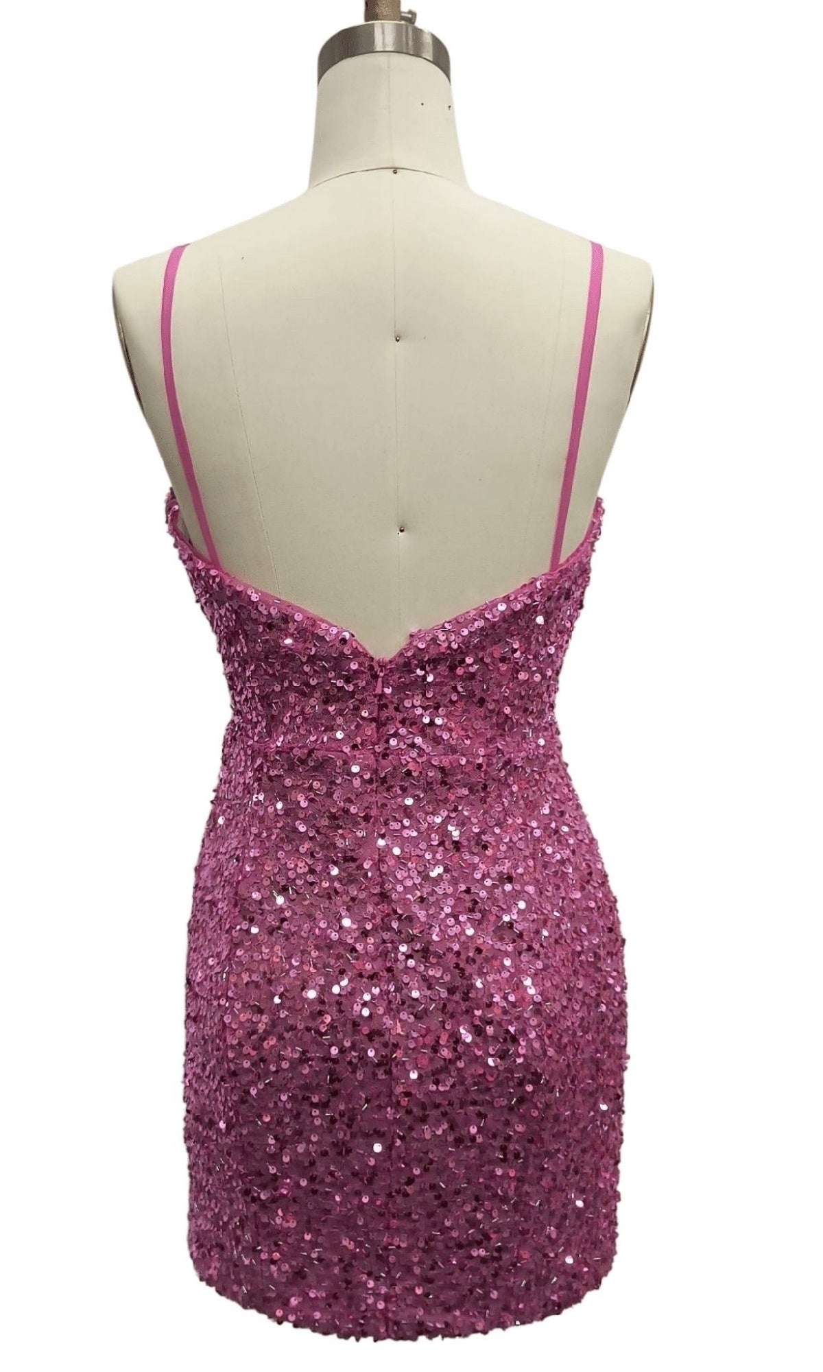 Back view of the Dave and Johnny 12393 Pink Sequin Homecoming Dress with a fitted mini silhouette and thin spaghetti straps displayed on a dress form.