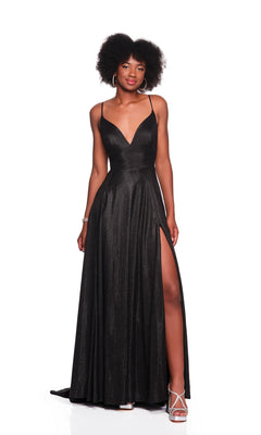 A woman wearing the Dave and Johnny 12408 long prom dress, featuring a sleeveless black design with a deep V-neck and high slit, pairs it with white strappy heels while standing against a white background.