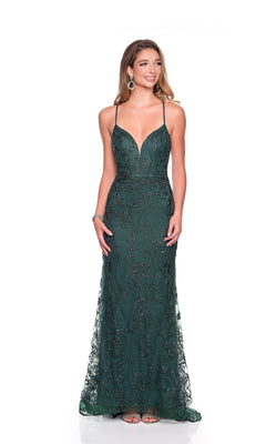 A woman models the Dave and Johnny 12409 long prom dress in emerald green, featuring intricate beadwork, thin straps, and a floor-length silhouette against a plain white background.