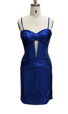 Cut-Out Short Metallic Hoco Dress 12512: a royal blue satin party dress with spaghetti straps, sweetheart neckline, corset-style bodice, front ruching, and a geometric cutout at the front, shown on a dress form.