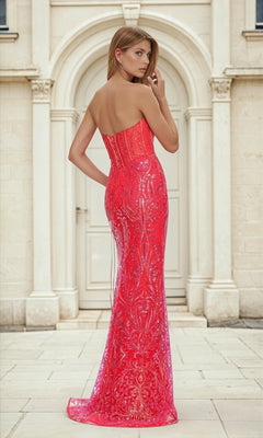 A woman in the Gold Print Strapless Long Red Prom Dress L516 stands outdoors before a light-colored arched doorway, looking over her shoulder.