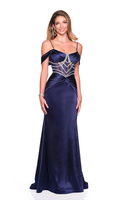 A woman wears the Dave and Johnny 12576 long prom dress, featuring navy blue satin, off-the-shoulder straps, and a beaded geometric bodice design.