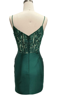 Back view of the Dave & Johnny 12583 short emerald green homecoming dress featuring thin straps, a sheer lace-embroidered corset bodice, and a fitted satin skirt.