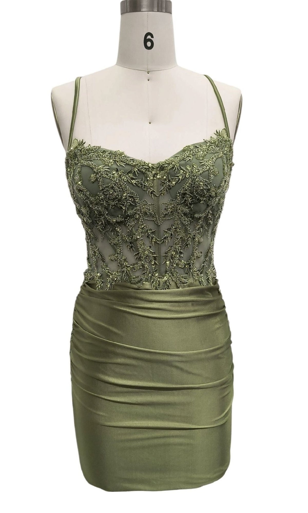 The Sage Green Short Hoco Dress 12584 features a sleeveless embroidered sweetheart bodice, spaghetti straps, and a fitted satin mini skirt—an ideal chic green party dress displayed on a dress form.