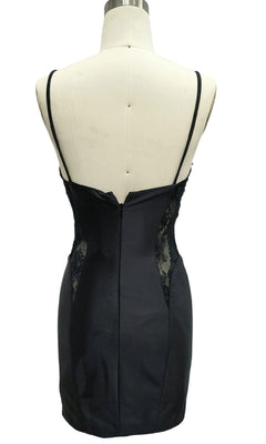 The Little Black Hoco Dress: 12588 features thin straps, lace side panels, and a back zipper, shown from the rear view on a dress form.