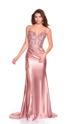 A woman in the Dave and Johnny 12601 long prom dress—a blush pink satin gown featuring a fitted silhouette, embroidered corset bodice with floral detail, spaghetti straps, deep neckline, and high leg slit—makes a stunning statement.