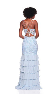 A woman stands against a white background wearing the Dave and Johnny 12671 long prom dress—light blue chiffon with a lace bodice, lace-up back, and tiered ruffle skirt.