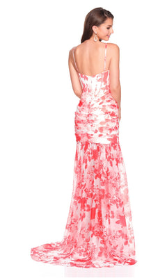 Woman wearing the Dave and Johnny 12692 long prom dress—a pink and white floral sleeveless gown with a satin corset bodice, ruched details, flowy chiffon skirt, and elegant train—stands with her back to the camera.
