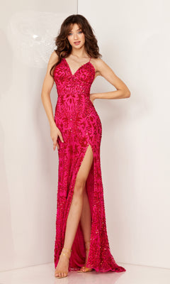 A woman wears the Beaded-Print Long Prom Dress: Aleta 1269, a sleeveless, strappy-back, floor-length gown with bright pink sequins and a high slit, standing against a plain light background.