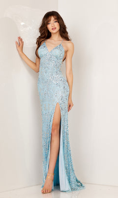 A woman stands against a white wall wearing the Beaded-Print Long Prom Dress: Aleta 1269, featuring light blue sequins, spaghetti straps, a strappy back, and a thigh-high slit for an elegant prom look.