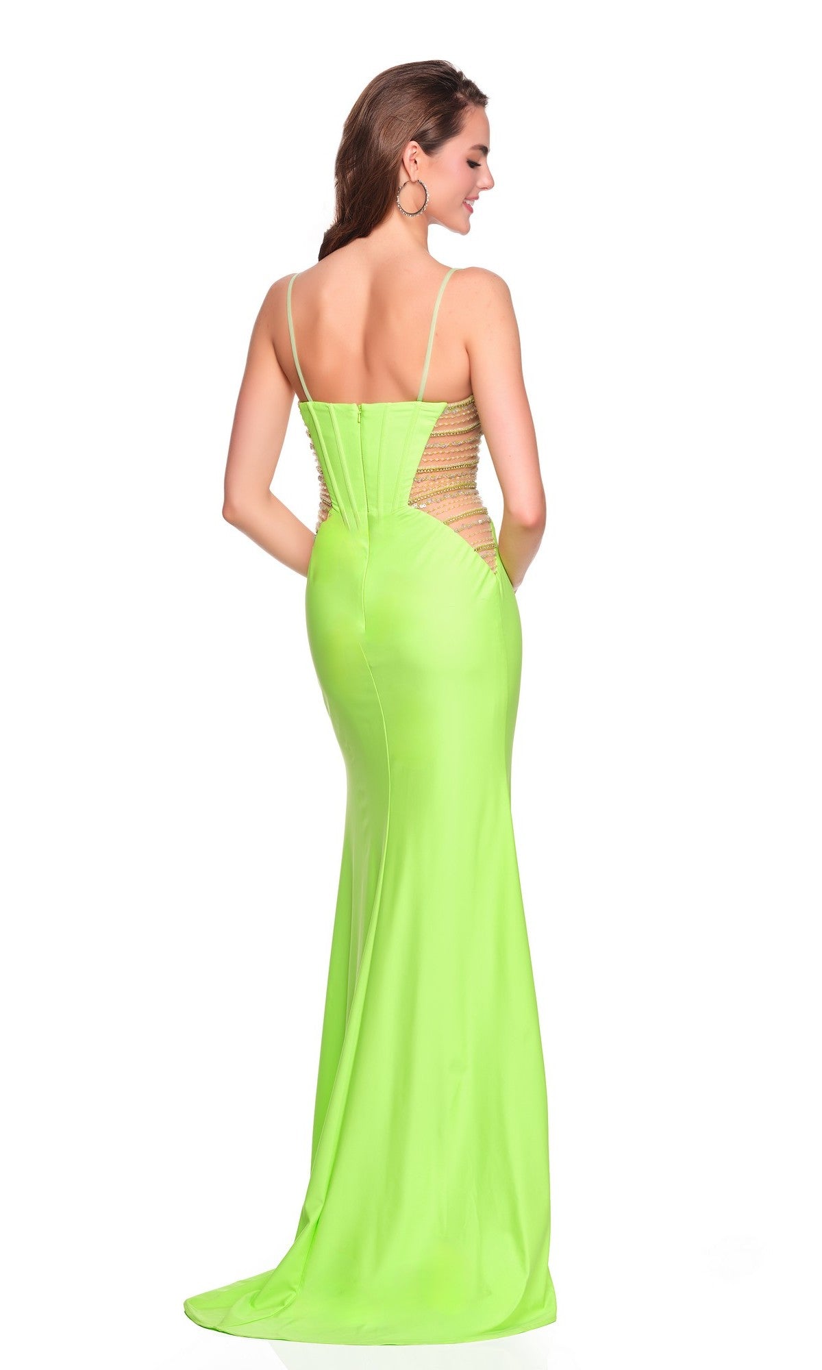 A woman stands with her back to the camera against a white background, wearing the Dave and Johnny 12710 long prom dress—a fitted neon green gown with thin straps and mesh side cutouts.