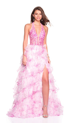 A woman models the Dave and Johnny 12766 long prom dress—a halter pink gown with an embellished fitted bodice, ruffled chiffon A-line skirt, and high slit—paired with silver heels against a white background.