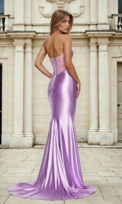 A woman in the Strapless Corset Long Charmeuse Prom Dress L768 stands outside a classical stone building, looking over her shoulder. The shiny, light purple gown features a lace-up back and elegant, figure-flattering design.