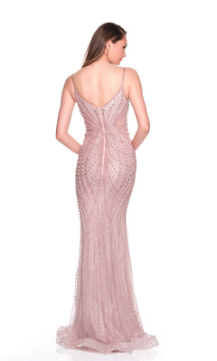 A woman faces away in the Dave and Johnny 12805 long prom dress—a sleeveless, light pink tulle gown adorned with bead embellishments and pearl appliques—against a white background.