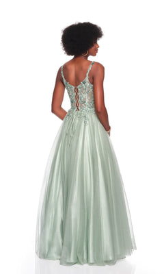 A woman wears the Dave and Johnny 12882 long prom dress, sleeveless and light green with a lace-embroidered corset bodice, floral lace details, lace-up back, and flowing tulle A-line skirt, standing against a white backdrop.