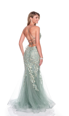 A woman poses against a white background wearing the Long Prom Dress: Dave and Johnny 12924, a mermaid-style light green gown with a lace-up open back and delicate embroidery appliques.