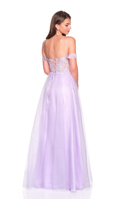 A woman stands against a white background wearing the Long Prom Dress: Dave and Johnny 12933—a purple off-the-shoulder gown with a lace-up back, sheer embroidered corset bodice, floor-length tulle skirt, and thigh-high slit.