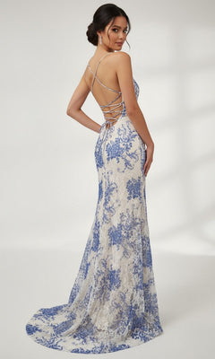 A woman models the Dave and Johnny 12950 long prom dress—sleeveless, blue, with a floral print and lace-up open back—looking over her shoulder.