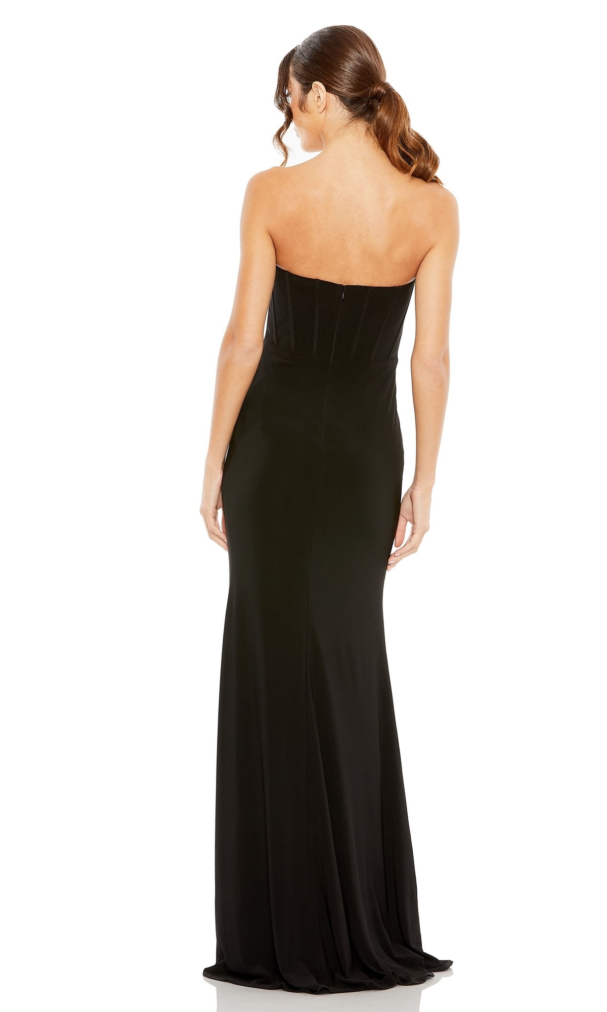 A woman with brown hair in a ponytail wears the Mac Duggal 13003, a strapless long black formal dress, standing with her back to the camera against a white background.
