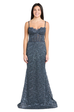 A woman models the strapless, floor-length Morgan 13269 long lace prom dress, featuring a semi-sheer bodice, as she smiles against a white background.