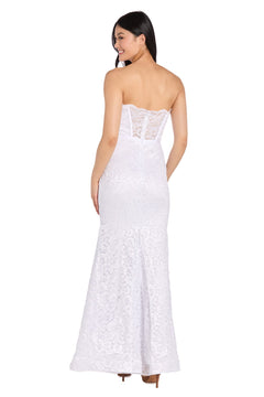 A woman is seen from the back wearing the Strapless Long Lace Prom Dress: Morgan 13269, a floor-length white gown with a fitted bodice.