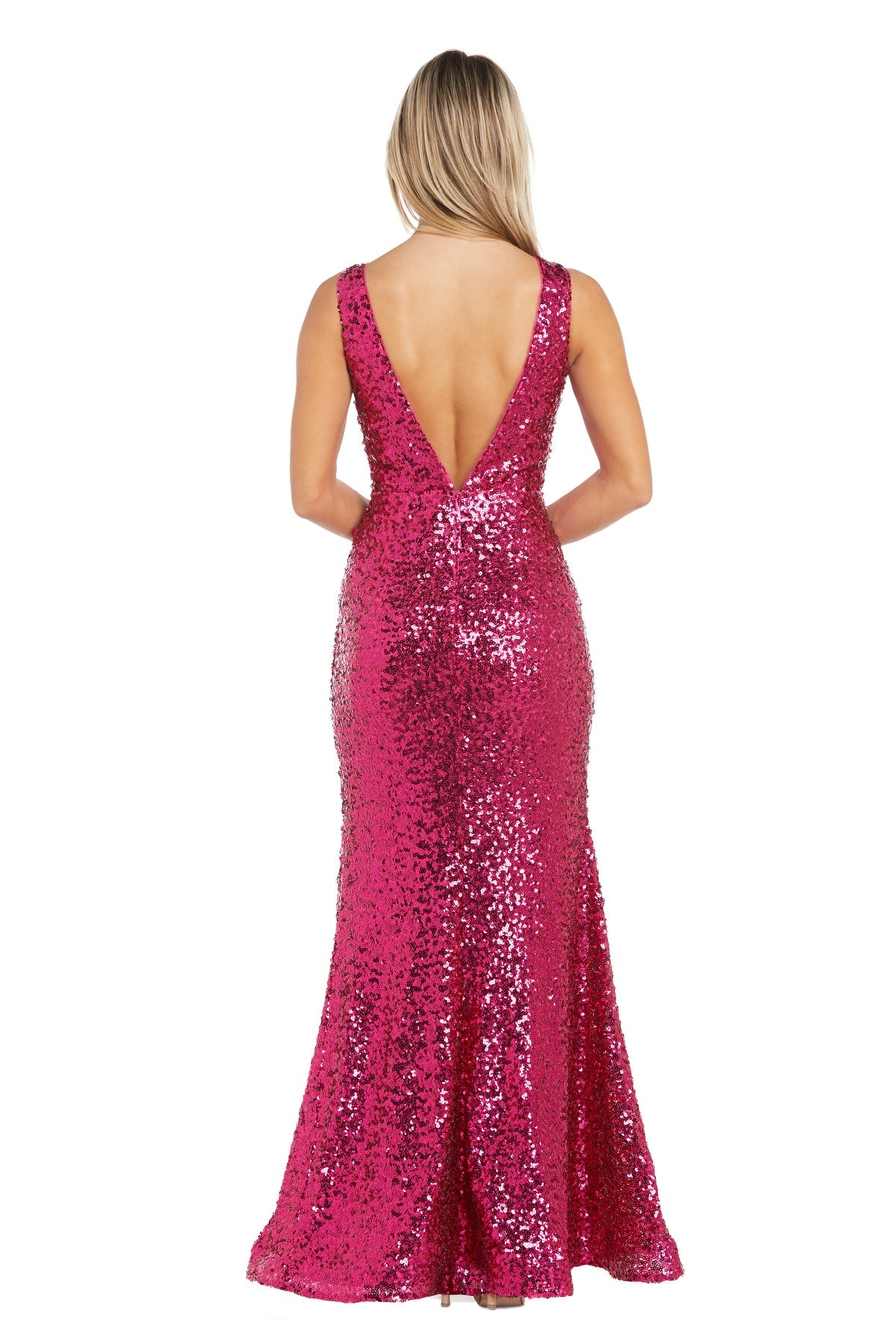 A woman faces away in the Morgan 13313 Long Sequin Prom Dress, featuring a magenta mermaid silhouette, floor-length hem, and deep V-back for an elegant look.