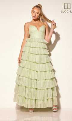 A woman poses against a plain background in the Lucci Lu 1342 Glitter Tulle Ruffle Prom Dress, featuring light green tiers, delicate straps, and a flowing ruffled skirt.