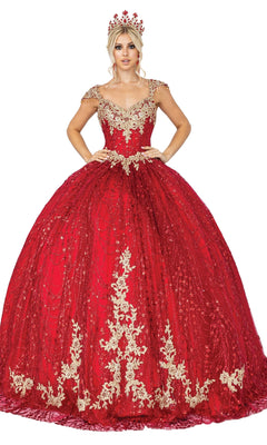 A woman in the Quinceanera Dress 1397 by Dancing Queen, featuring a red a-line ball gown with gold embroidery, sweetheart neckline, and matching crown, poses with her hands on her waist against a white background.