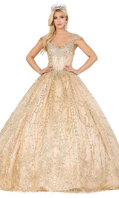 A woman poses with hands on hips in the Quinceanera Dress 1397 by Dancing Queen, a gold embellished A-line ball gown with cap sleeves and a full skirt, accessorized with a jeweled crown against a white background.