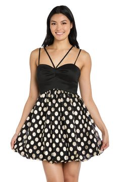A woman stands smiling in the Morgan 14038 Black and Gold Bubble Party Dress with a fitted satin bodice and flared skirt adorned with bold gold polka dots—a perfect semi-formal choice for festive occasions.
