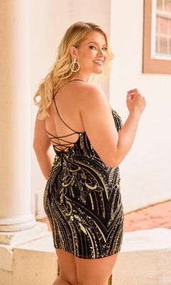 A woman with long blonde hair models the Plus-Size Mini Beaded Hoco Dress: Primavera 14093, featuring black and gold sequins and a strappy-back design, as she smiles over her shoulder by a white column.