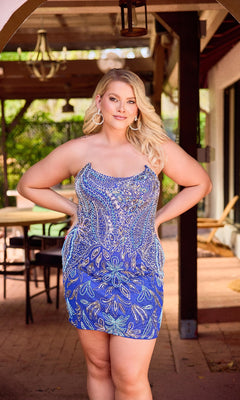 A woman with long blonde hair poses outdoors on a covered patio, wearing the Plus-Size Strapless Hoco Dress: Primavera 14094 and looking at the camera with her hands on her hips.