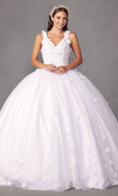 A woman smiles against a gray background, wearing the Juliet 1437W Traditional White Quinceañera Dress with floral appliques and a jeweled headband.